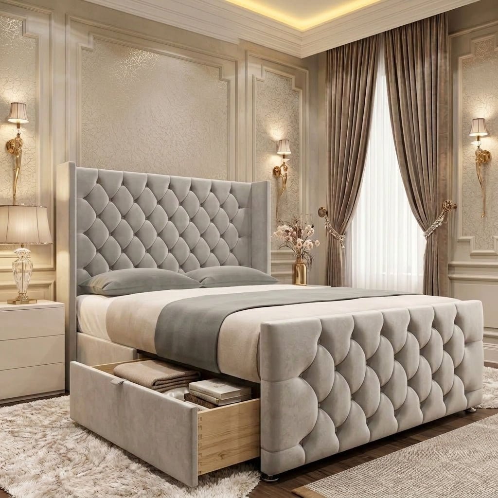 Light grey diamond-tufted divan bed displaying a spacious open side drawer for storing bedding and bedroom essentials.

