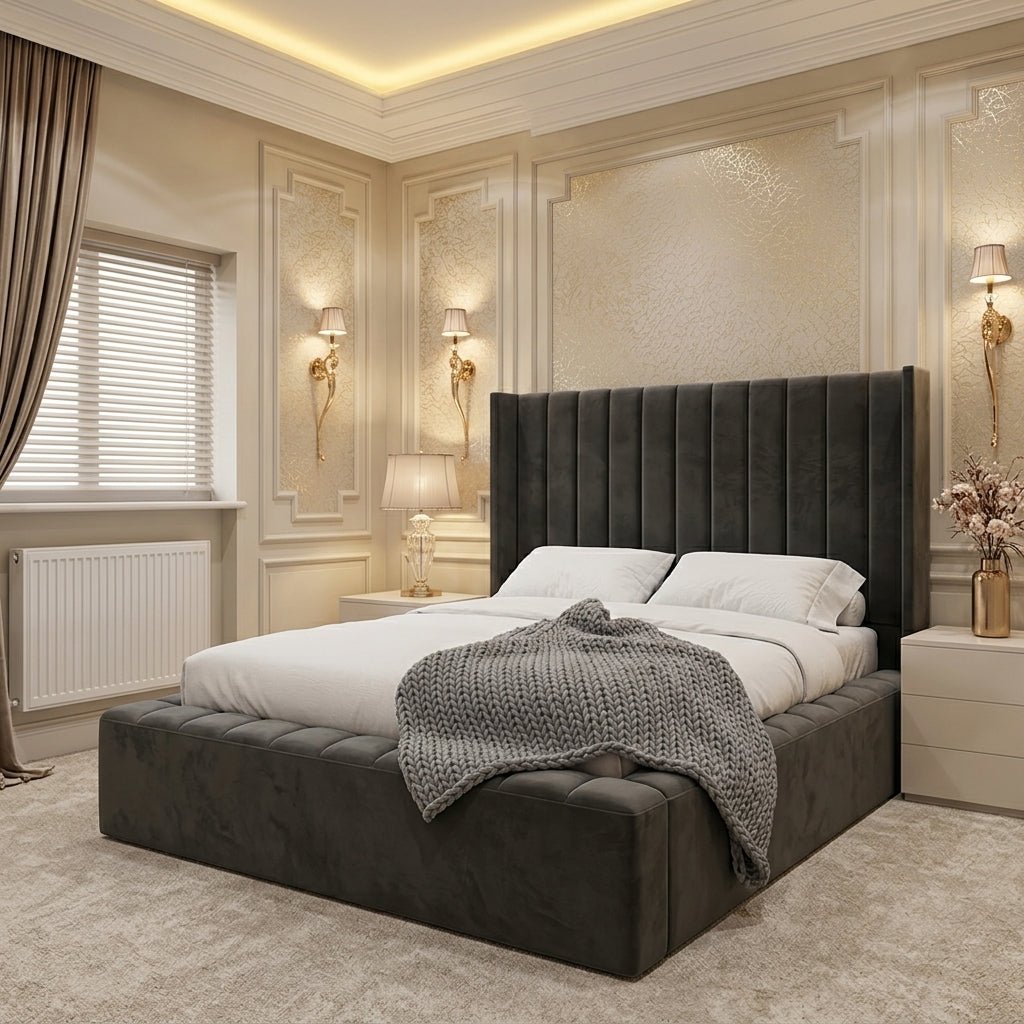 Dark grey upholstered Ambassador bed with a tall winged headboard, vertical panel detailing and a deep padded bed frame.
