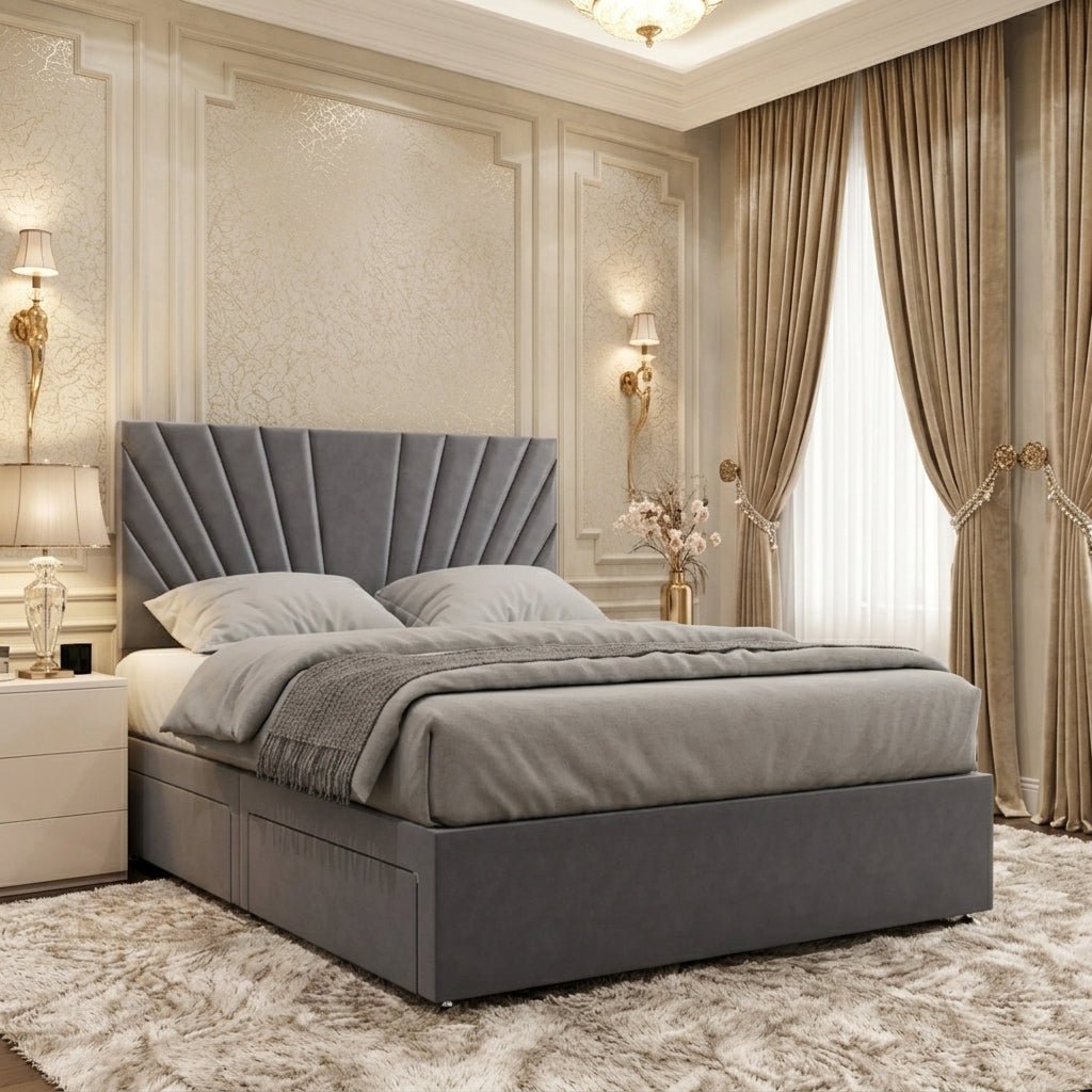 Grey upholstered divan bed with a fan-shaped sunburst-panelled headboard and a streamlined matching base.
