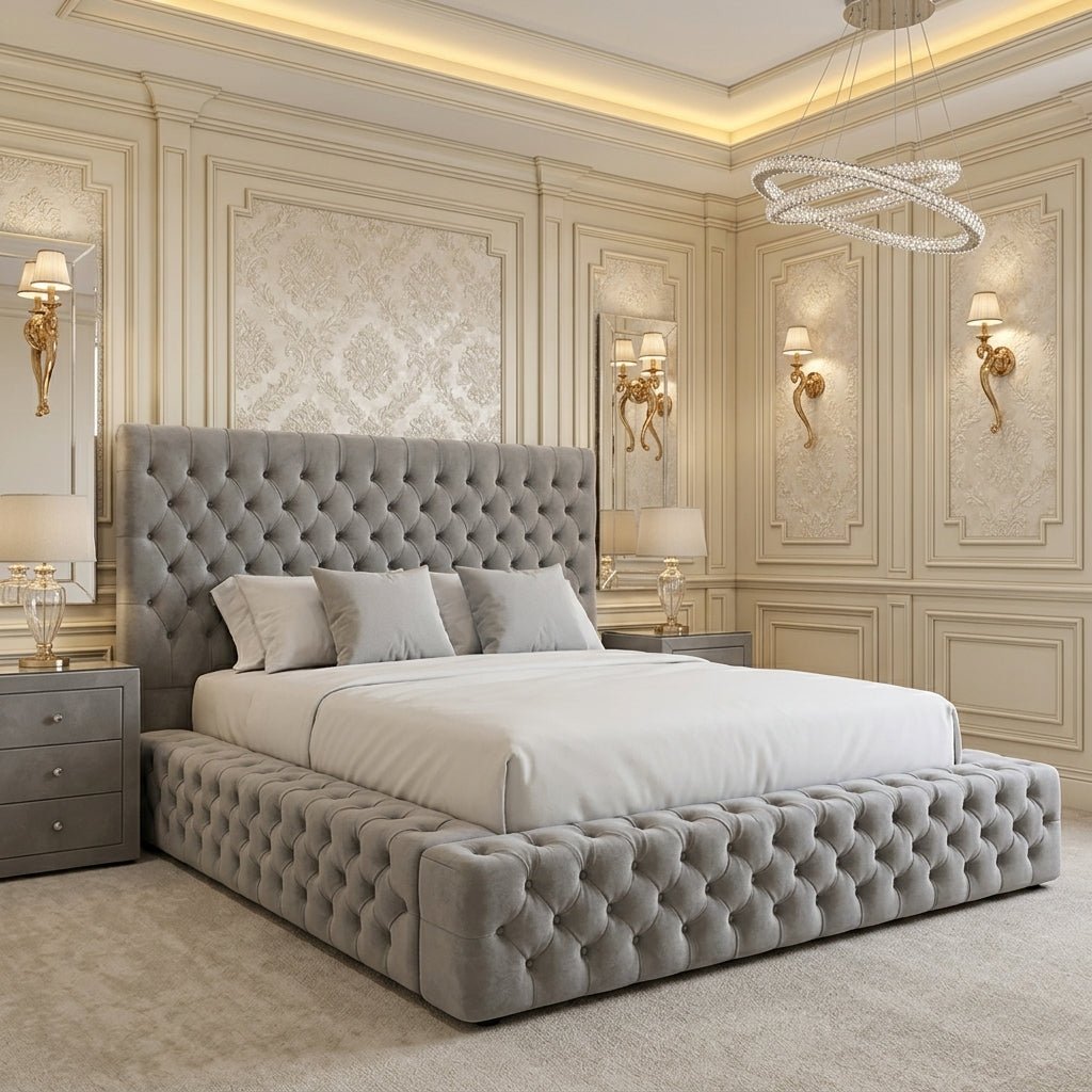Light grey upholstered Ambassador bed with a tall diamond-buttoned headboard, matching padded side rails and a deep-buttoned footboard.

